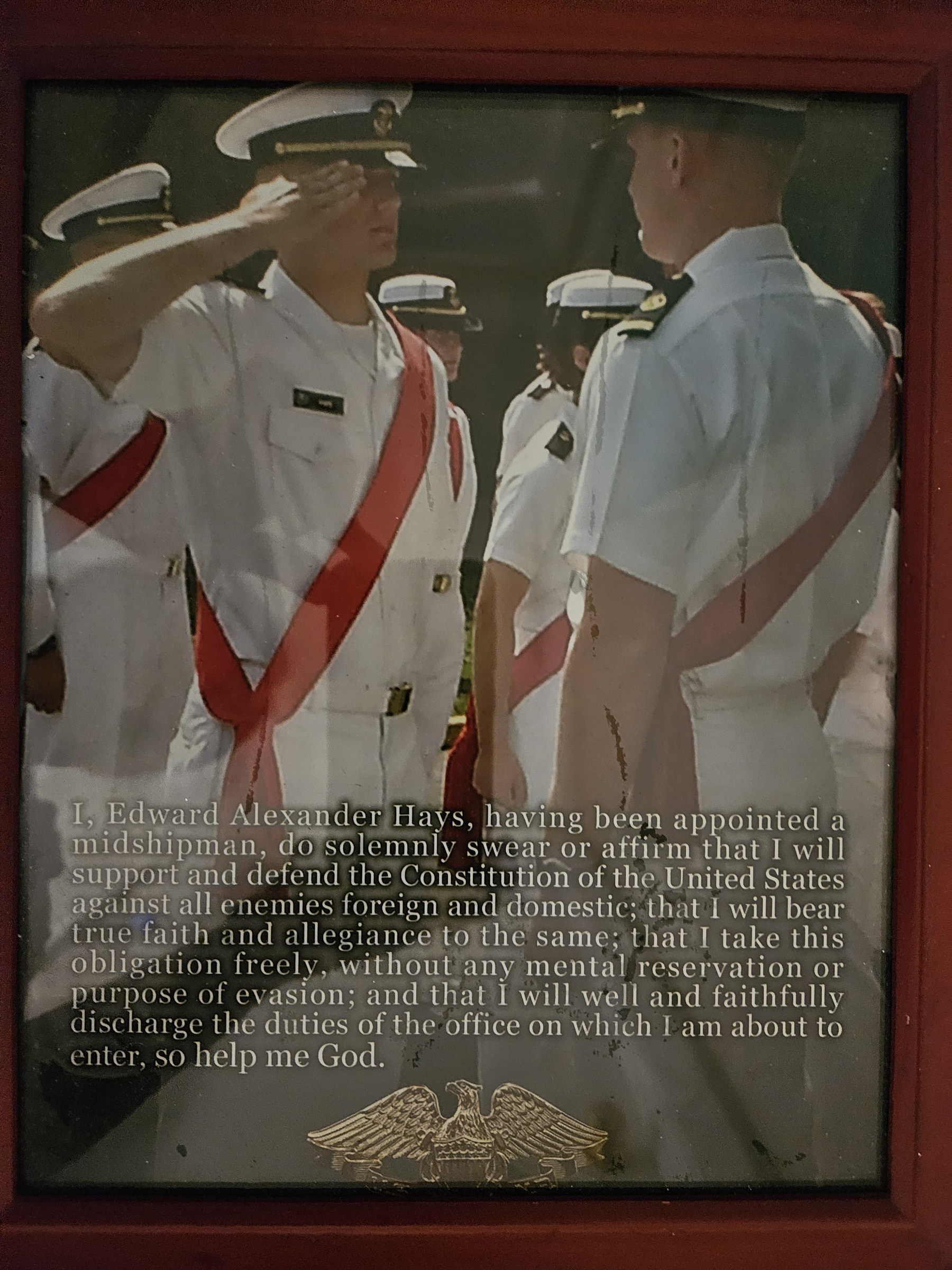 Alex Hays at USMMA Kings Point, dress whites, saluting — Midshipman's Oath of Office overlay.