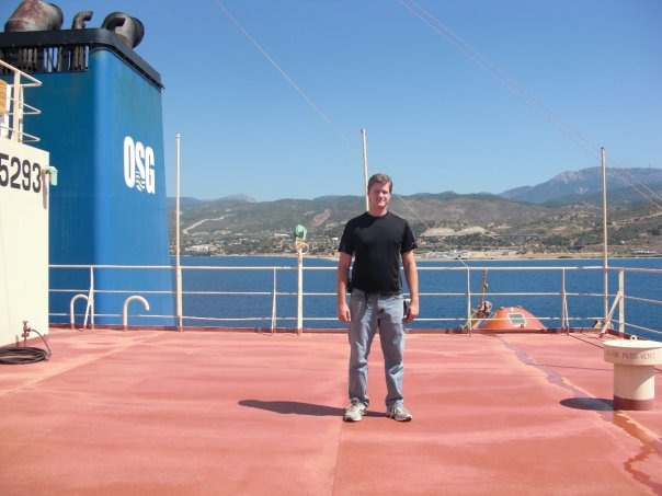 Alex Hays on the deck of an OSG tanker, Mediterranean port — sixteen years in the merchant marine.